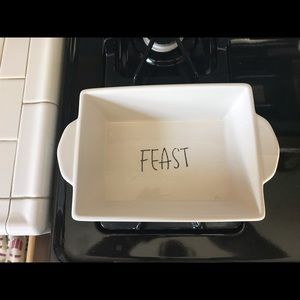 White ceramic loaf pan with the words FIEST inside